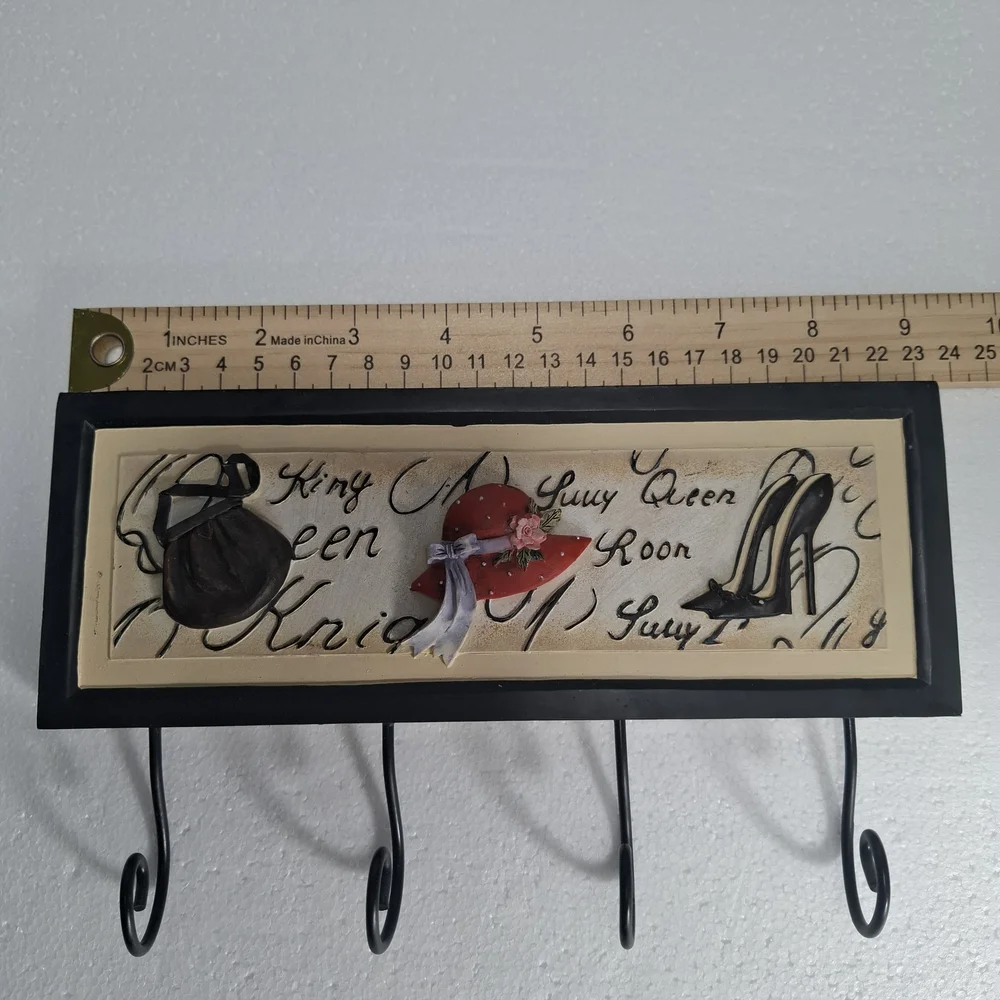Wall Hook Rack with Black Frame and Red Hat Accent